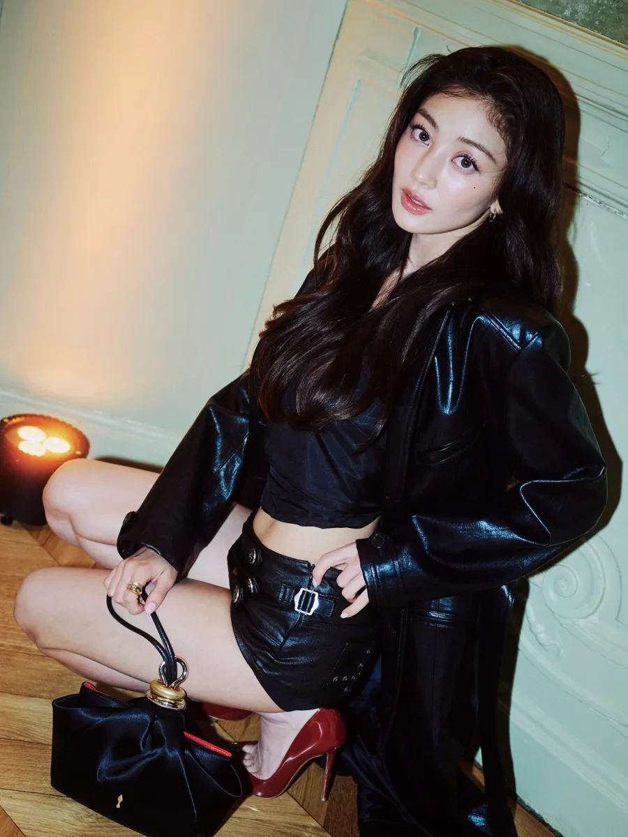 Jihyo in a black leather coat and red Louboutin heels in Paris